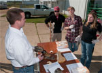 Students looking over display