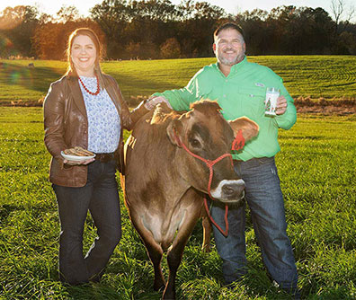 Jessica and Kenneth Graves with a Jersey diary cow