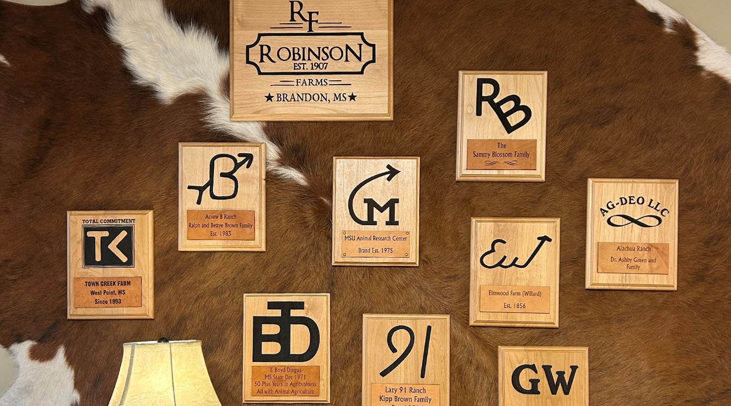 Add your Brand and Establish Your Legacy - image is depicting many plaques on a wall